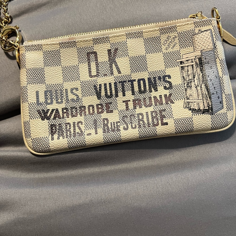 Louis Vuitton wristlet.